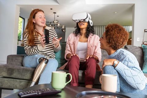 Diverse Women Experiencing Virtual Reality in Cozy Home