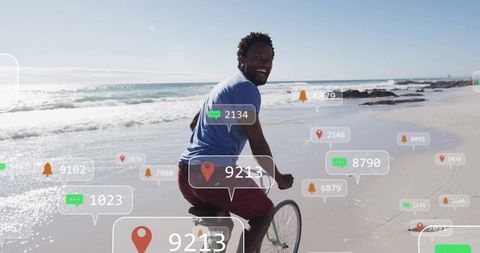 Man cycling beach technology overlays digital adventure