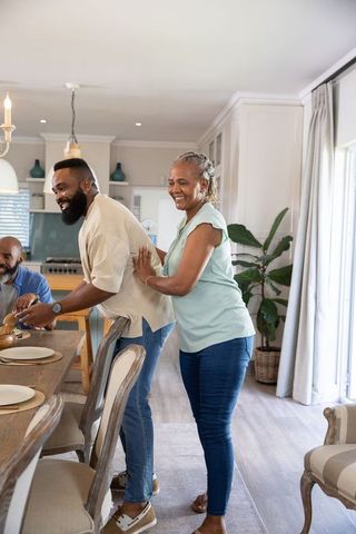 Family Gathering in Modern Kitchen with Covered Dish