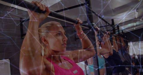 Woman Gripping Pull-Up Bar in Gym with Geometric Network Overlay, Group Strength Workout