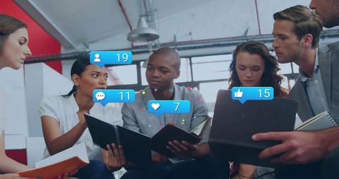 Team Brainstorming with Social Media Engagement Icons in Modern Open Office Collaboration