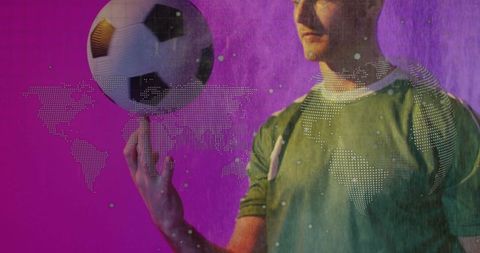 Soccer Player in Green Jersey Balances Ball with Digital World Map