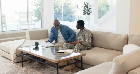 Military Son with Elderly Father on Sofa Sharing a Laptop Challenge