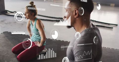 Trainer monitoring athlete performance with augmented reality fitness metrics and charts