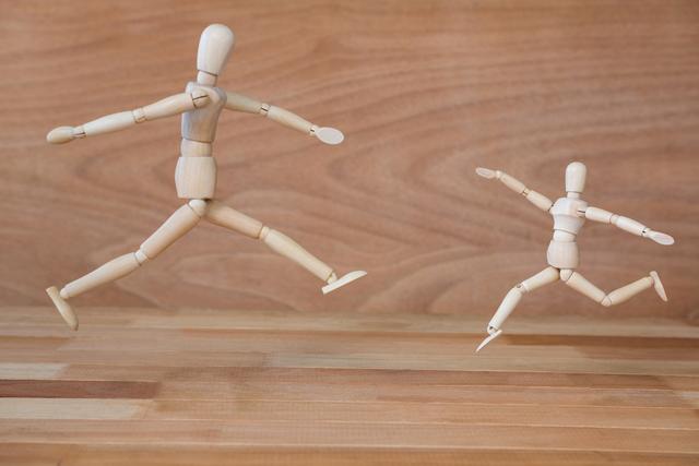 Conceptual image of figurine performing stretching exercise