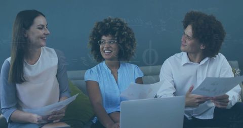 Diverse Team Discussing Business Insights in Modern Office