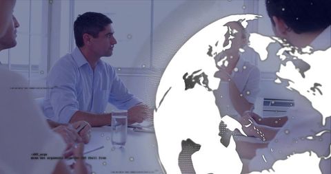 Business team discussing global strategy at white meeting table with modern globe overlay