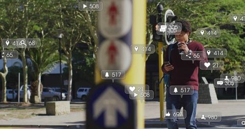 Urban commuter checking smartphone while holding coffee with social media notifications
