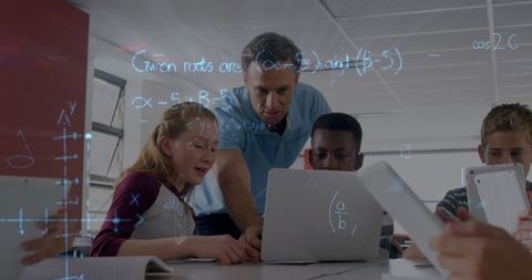 Teacher Guiding Students with Laptops and Digital Math Equations - Download Free Stock Images Pikwizard.com