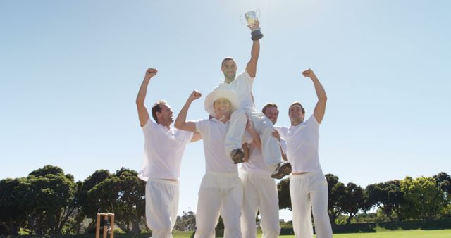 Cricket Team Celebrating Victory Holding Trophy - Download Free Stock Images Pikwizard.com