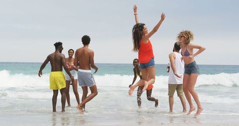 Diverse Group of Friends Enjoying Summer Day at Beach