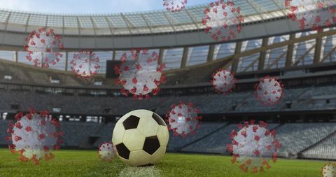 Covid-19 Impact on Sports Highlighted with Soccer Ball in Empty Stadium