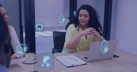 Businesswoman leading hybrid meeting with augmented reality holograms and laptop