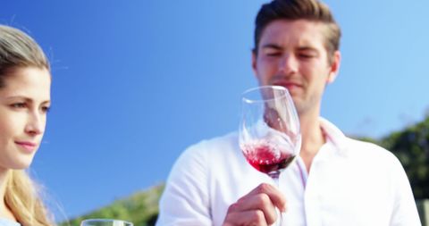 Couple Examining Wine Outdoors on a Sunny Day - Download Free Stock Images Pikwizard.com
