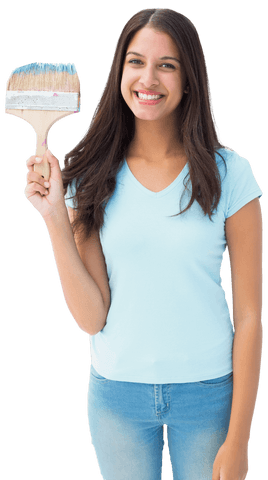 Smiling woman holding large paintbrush over white background