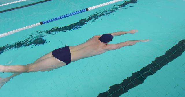 Male Swimmer Practicing Front Crawl in Indoor Pool - Download Free Stock Images Pikwizard.com