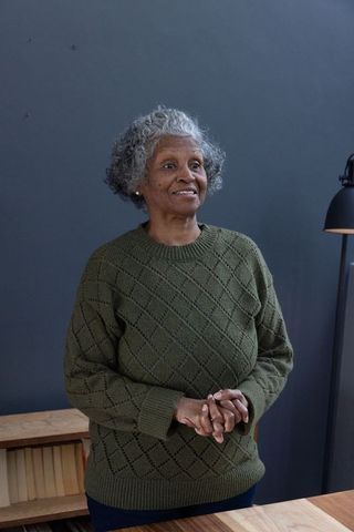 Senior Woman Contemplating in Office Setting