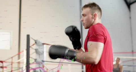 Male boxer training in ring with digital performance data overlay showing focus and power