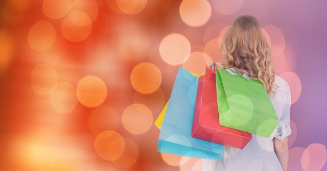 This image depicts a woman carrying multiple colorful shopping bags with a festive bokeh background. Ideal for use in marketing materials related to holiday sales, shopping promotions, and retail events. Perfect for advertisements, banners, and social media posts aimed at showcasing retail success, consumer habits, or lifestyle content.