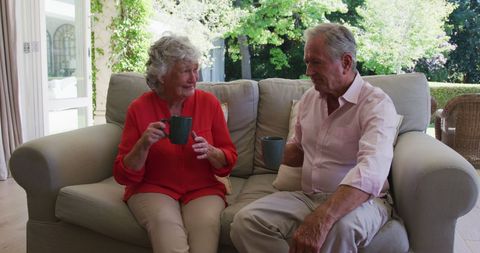 Senior Couple Enjoying Coffee at Home in Cozy Living Room - Download Free Stock Images Pikwizard.com