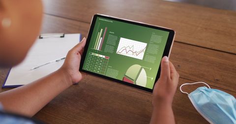 Analyzing Data on Tablet with COVID Precautions - Download Free Stock Images Pikwizard.com