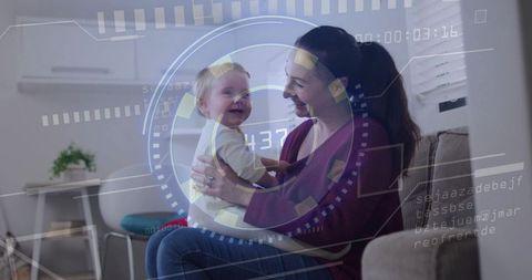Caregiver holding smiling baby on sofa with futuristic hud overlay smart home monitoring