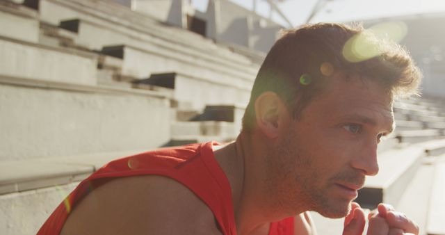 Determined Athlete Resting on Stadium Steps - Download Free Stock Images Pikwizard.com