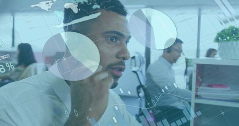 Technology Concept with Diverse Teams Analyzing Data Interfaces in Office