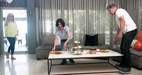 Team Decorating Room and Preparing Snacks for Welcome Event