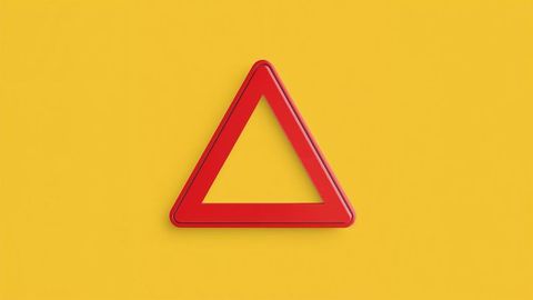 Red triangular frame on bright yellow backdrop
