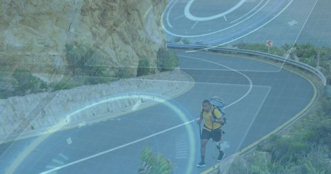 Hiker Exploring Mountain Trail with Futuristic Overlay