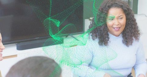 Woman Leading Team Meeting in Modern Office with Green Digital Data Overlay