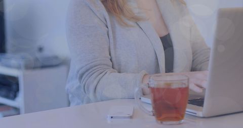 Businesswoman Using Laptop with Tea and Smartphone - Download Free Stock Images Pikwizard.com