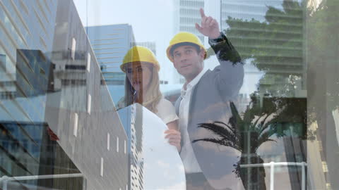 Architects Collaborating with Cityscape Reflection