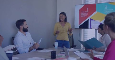 Dynamic team meeting: confident presentation enhances business strategy