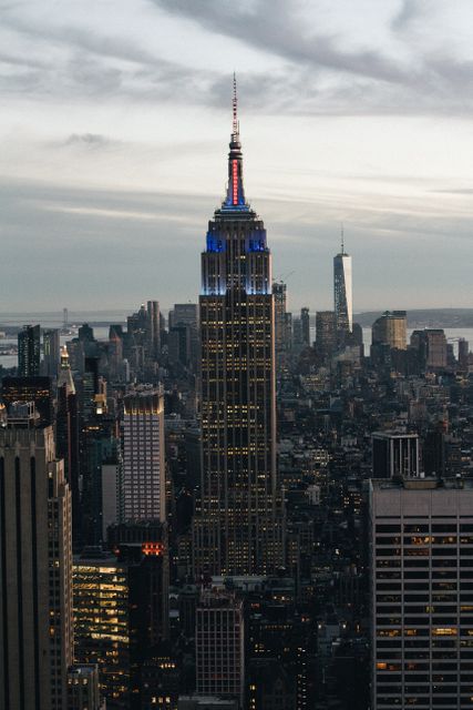 Empire State Building at Dusk with New York City Skyline - Download Free Stock Photos Pikwizard.com