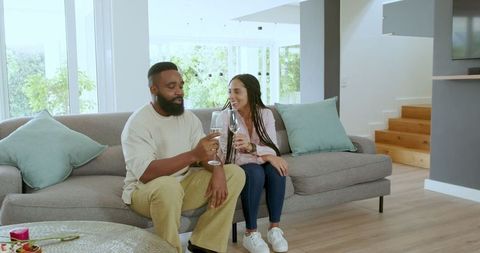 Couple Toasting Celebrating Special Moment at Home
