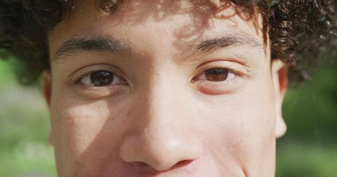 Close Up of Joyful Biracial Man at Sunny Outdoor Wedding