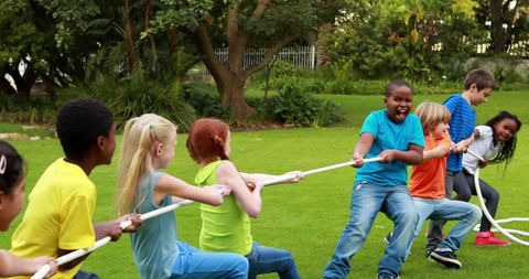 Children Enjoying Outdoor Tug-of-War Game at Park - Download Free Stock Images Pikwizard.com