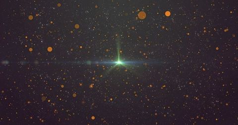Glowing green starburst with horizontal lens flare and amber bokeh in cosmos