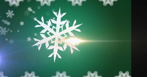 Festive white snowflake with sparkling green background