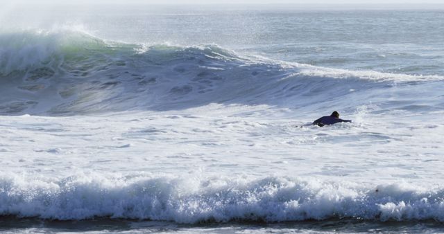 Lone Surfer Navigating Challenging Ocean Waves - Download Free Stock Images Pikwizard.com