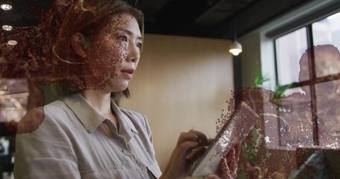 Professional Woman Using Tablet in Modern Office Space