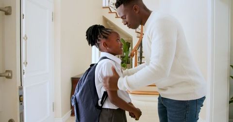 Father Talking to Daughter Before School, Family Home Morning Routine