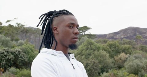 African American Man Standing and Looking Right on Rugged Ridge Wearing White Hoodie