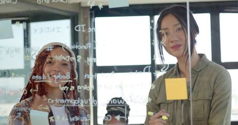 Diverse Female Colleagues Collaborative Office Brainstorming