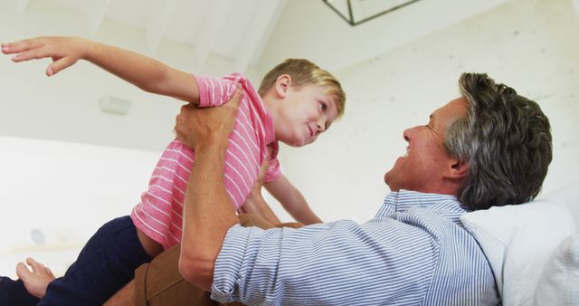 Happy Father Playing with Young Son at Home - Download Free Stock Images Pikwizard.com