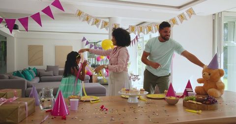 Family Birthday Celebration with Festive Decorations and Smiling Together