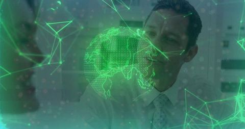 Business professionals exploring holographic globe technology