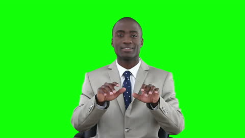 Businessman Typing on Invisible Keyboard in Office Setting